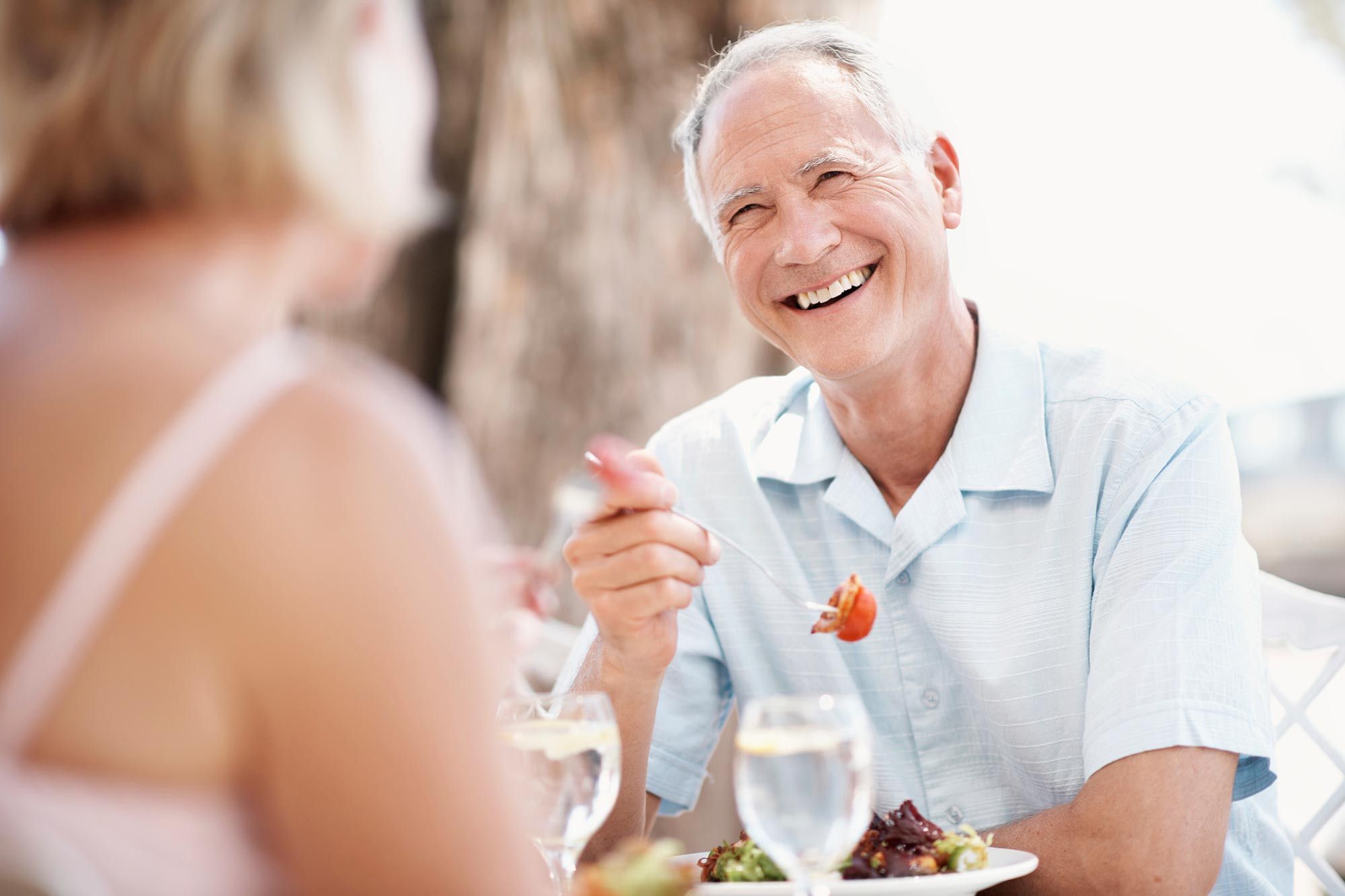 Elderly couple have drinks